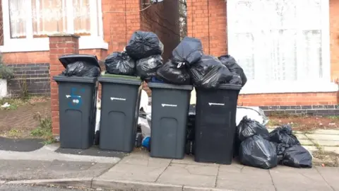 Rubbish piled in Erdington, Birmingham in February