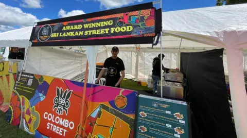 Steve Huntley/BBC A food stand at the festival