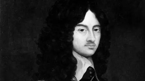 PA Media A black and white portrait from about 350 years ago showing King Charles the second. He has long black curly hair and is wearing a black shirt with a large white billowing collar