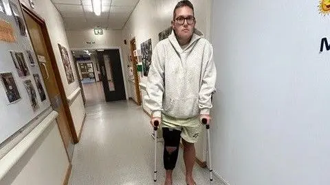 Hudgell Solicitors man on crutches in hospital 