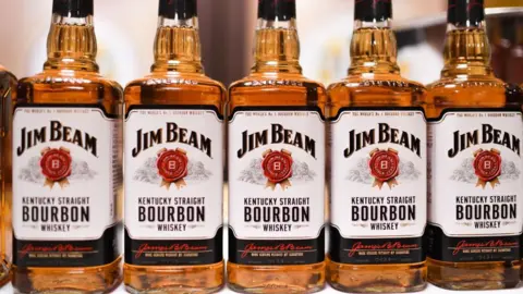 Bottles of Jim Beam whiskey displayed side-by-side on a table
