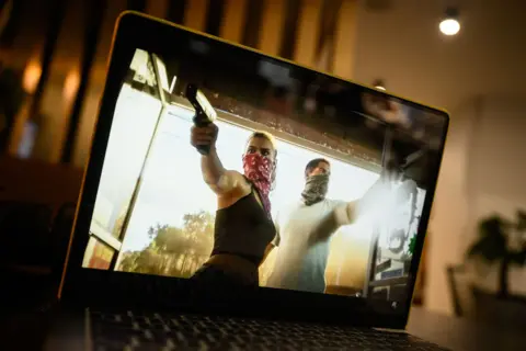 Getty Images In this photo illustration, the trailer for the "Grand Theft Auto 6" console game is seen on a laptop screen on December 05, 2023 in London, England.