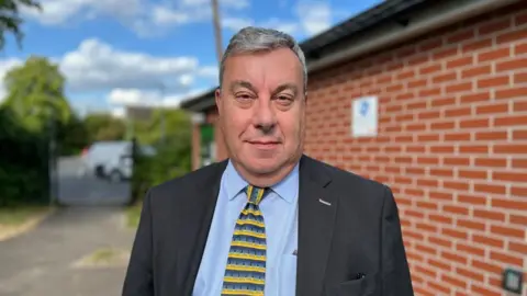 Councillor David Ellis, portfolio holder for Public Protection on Gedling Borough Council, stood in front of the toilet block.