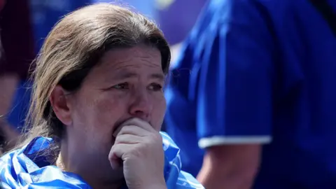Reuters An emotional Everton fan struggles to hold back tears