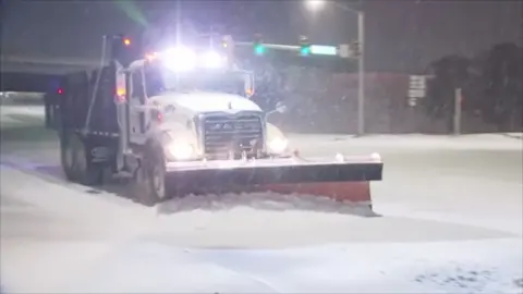 Snow plow on road