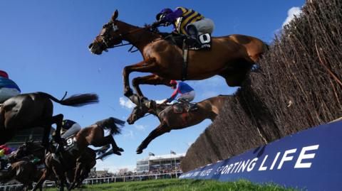 Cheltenham Festival 2023 - Champions Day - Cheltenham Racecourse. Corach Rambler ridden by Derek Fox on their way to winning the Ultima Handicap Chase on day one of the Cheltenham Festival at Cheltenham Racecourse. Picture date: Tuesday March 14, 2023. PA Photo. See PA story RACING Cheltenham. Photo credit should read: Mike Egerton/PA Wire.