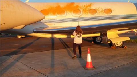 Climate-activist spray-painting aircraft with orange paint