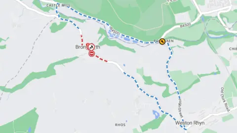 One.Network A map shows the diversion which is in place during the Bronygarth road closure. A red dotted line indicates where the road is closed, while a blue dotted line shows the diversion route, which goes into Wales. 