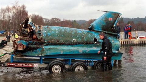 The wreck of the Bluebird being pulled from Coniston Water in 2001