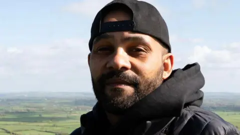 Key4Life Trueman standing in the countryside 