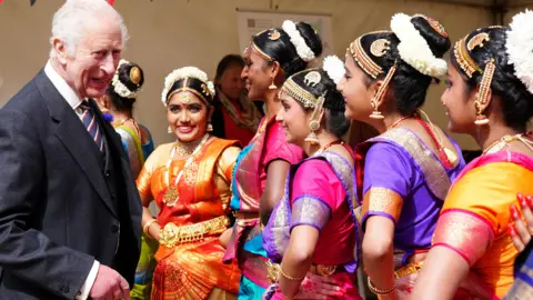 Reuters  King Charles speaks to performers at a celebration at Edinburgh Castle to mark the 900th Anniversary of the City of Edinburgh