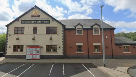 Google A street view image of a pub from its car park, with the main part of the building coloured beige and an extension on the right in brick. A sign at the top of the pub says "Chatterley Whitfield".