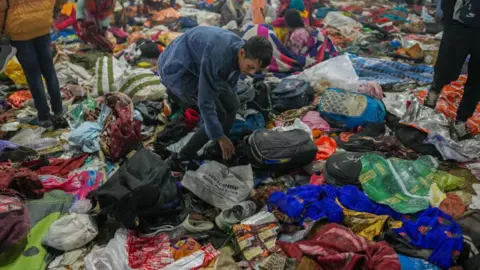 Getty Images PRAYAGRAJ, INDIA - JANUARY 29: Hindu pilgrims look for their belongings at the site of a stampede amid the ongoing Maha Kumbh Kumbh Mela festival in Prayagraj, India on January 29, 2025. Many people are feared dead after a stampede at the Maha Kumbh Mela, a Hindu festival being touted as the world's largest religious congregation, which kicked off this month in the northern state of Uttar Pradesh. (Photo by Amarjeet Kumar Singh/Anadolu via Getty Images)