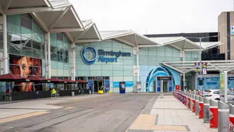 Getty Images The name sign and facade of Birmingham Airport building. - stock photo