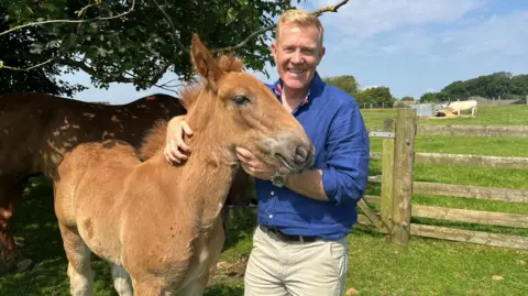 BBC Adam Henson on his farm in the Cotswolds