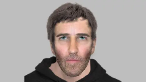 A digitally put together image of a man with blue eyes, grey stubble and ash brown hair wearing a black hoodie with a grey background behind.