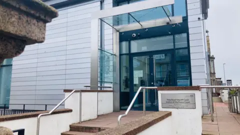 Steps leading up to Peterhead Sheriff Court and the main court building.