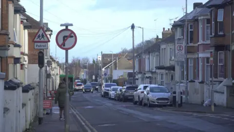 Local Democracy Reporting Service A road with Victorian terraced housing either side.