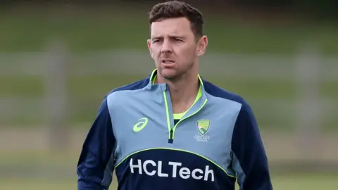 Josh Hazlewood with a forlorn expression while training for Australia