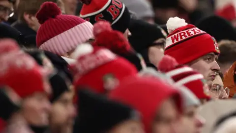 Wrexham fans watch the game against Birmingham City at the Stok Racecourse