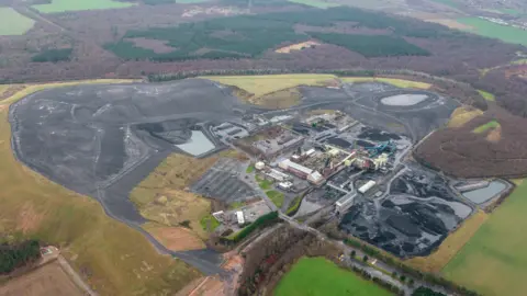 Harworth Group An aerial photograph showing the redundant coalfield, with its black spoil heap.