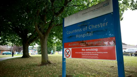 Signage is seen outside an entrance to the Countess of Chester Hospital in Chester