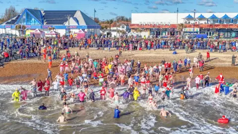St Elizabeth Hospice Aerial view of swimmers going into the sea