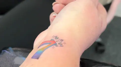 Joshua Cook/BBC Tattoo on woman's wrist