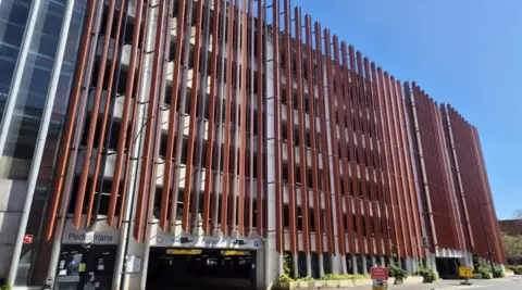 Swindon Borough Council A large car park with red beams up and down the side