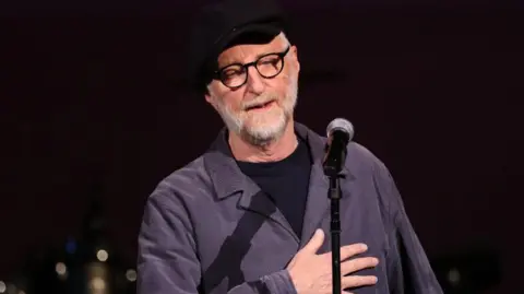 Getty Images A picture of songwriter Billy Bragg performing as part of 'A St. Paddy's Celebration of Sinead O'Connor and Shane MacGowan' at Carnegie Hall in New York City on 20 March, 2024.