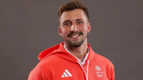 Daniel Jervis smilers in Team GB Paris 2024 kit
