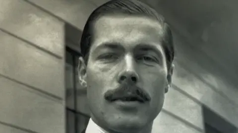 Black and white photo of Lord Lucan, a man with a moustache.