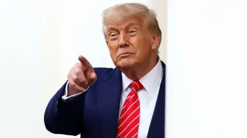 US President Donald Trump speaks to the media outside West Wing of the White House in Washington DC, 8 May 2025.
