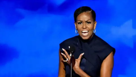 Michelle Obama speaks on stage at DNC