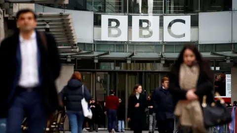 Reuters External view of BBC New Broadcasting House with staff coming in and out
