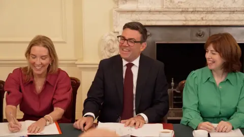 Andy Burnham smiles during government cabinet meeting