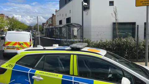 A police car outside the building 