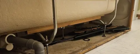 PSNI Gun hidden underneath a bath