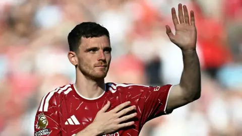 Andy Robertson waves to Liverpool fans after final match at Anfield