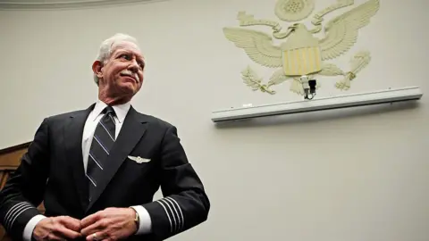 U.S. Airways Capt. Chesley "Sully" Sullenberger III prepares to testify before the House Judiciary Committee's Commercial and Administrative Law Subcommittee on Capitol Hill December 16, 2009 in Washington, DC. 