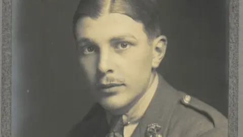Repton School Archives A black-and white image of (Edward) Roy Pallett in his Army officer uniform. He has slicked back hair and a slight moustache.