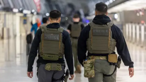 Immigration and Customs Enforcement (ICE) officers patrol Dulles International Airport in Dulles, Virginia. Photo: 26 March 2026