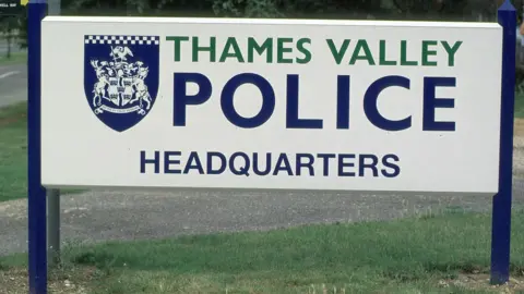 Sign that reads "Thames Valley Police headquarters" with the force's logo.