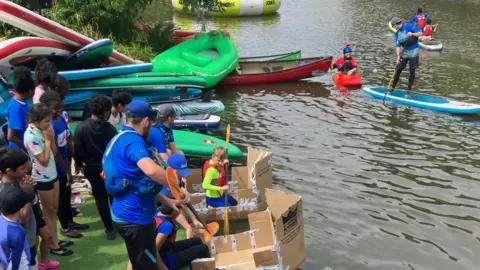 Canoe Trail A number of people taking part in sporting activities at the Bedford River Festival