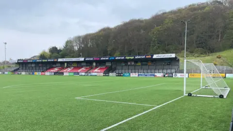The main stand of the Scarborough Sports Village from pitch side - as well as a small dip in the six yard box of the football pitch where the damage is taken affect