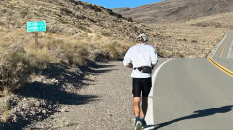Andrew Kelly Kelly passes the 4,000ft (1,219m) elevation mark during the Badwater 135, which he completed in 31 hours, 44 minutes and 37 seconds