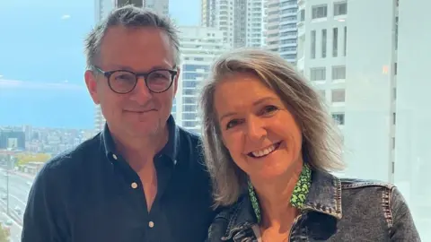 Michael and Clare Mosley standing together and smiling