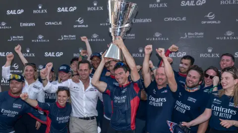 The British team celebrate with the SailGP trophy