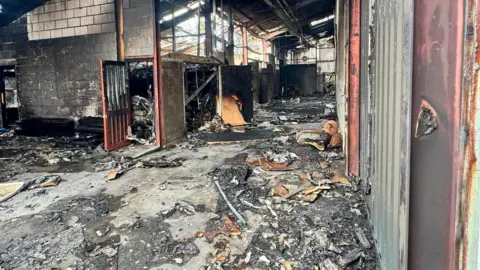 An industrial estate which has been completely gutted by a fire.
