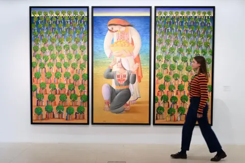 Alamy A triptych by Sliman Mansour, entitled Orange Fields, on display at Christie's London, UK (31 October 2025)